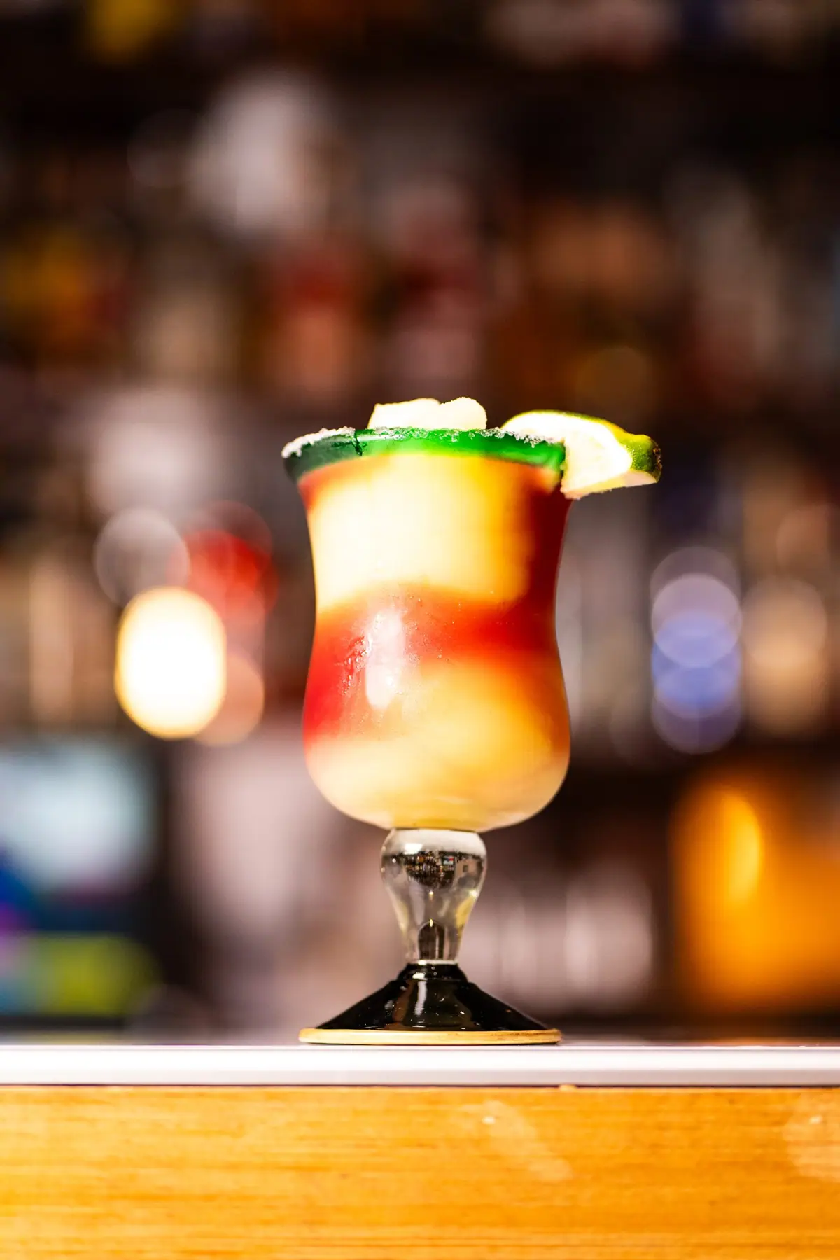 A layered margarita with a sugared rim and lime at the El Porton bar